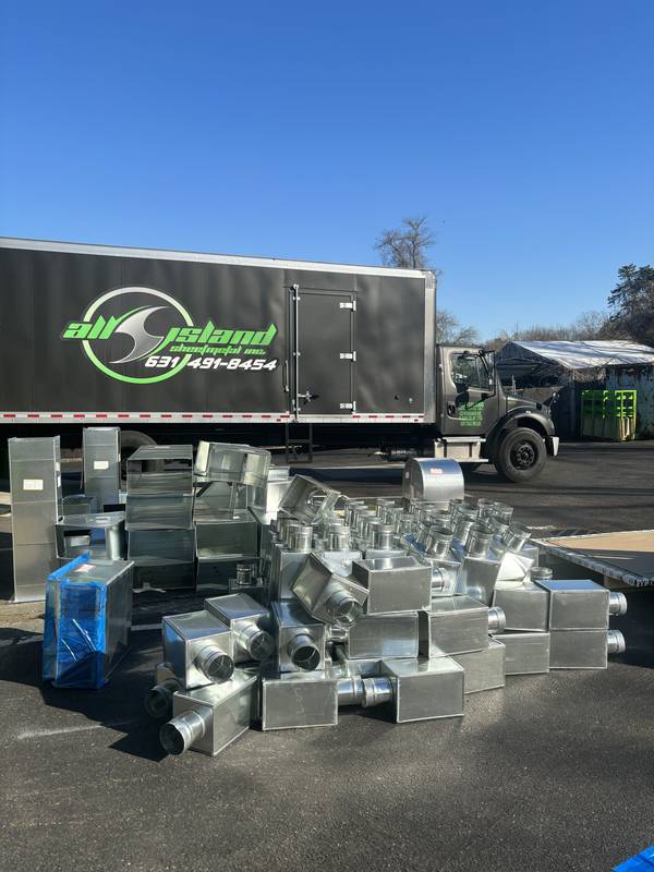 Duct fittings staged at company truck