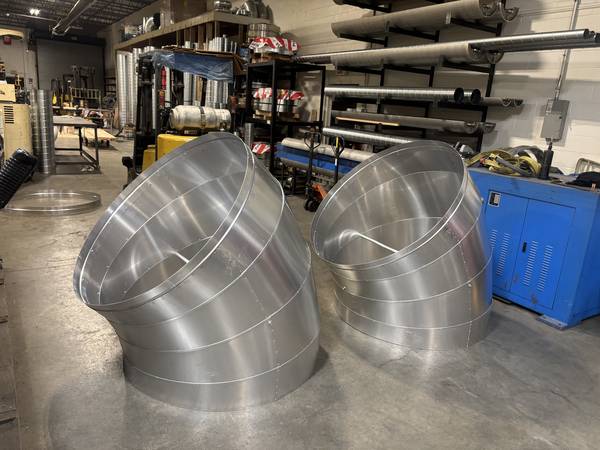 Large spiral duct elbows
